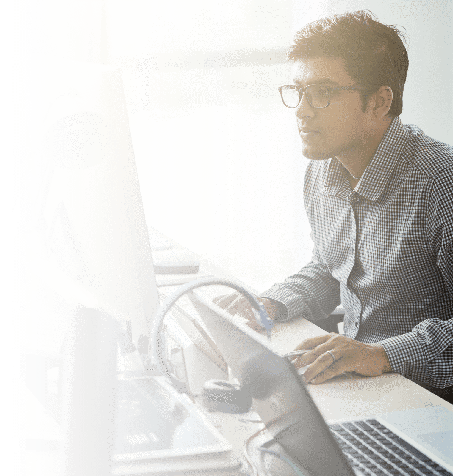 Young talented programmer reading code on computer screen