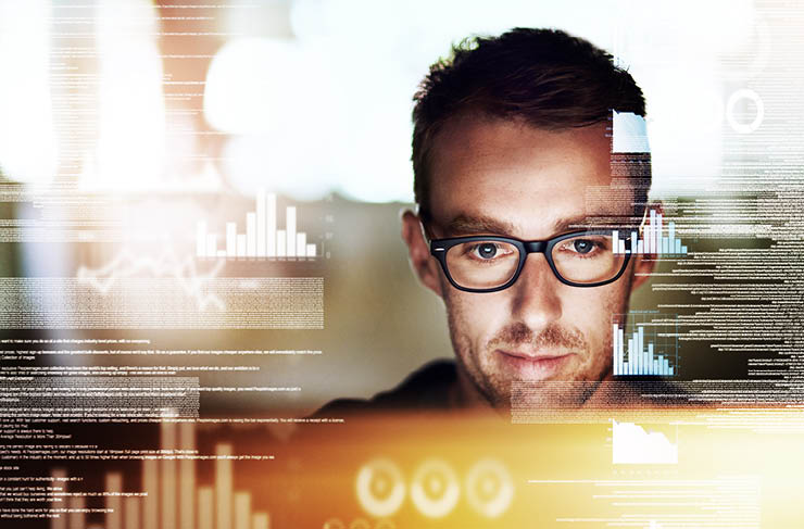 Shot of a programmer working on a computer code at night